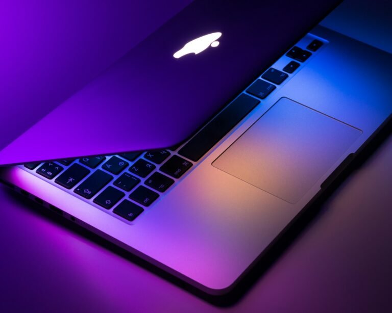 Slightly opened silver macbook
