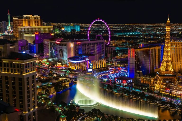 City with lights turned on during night time