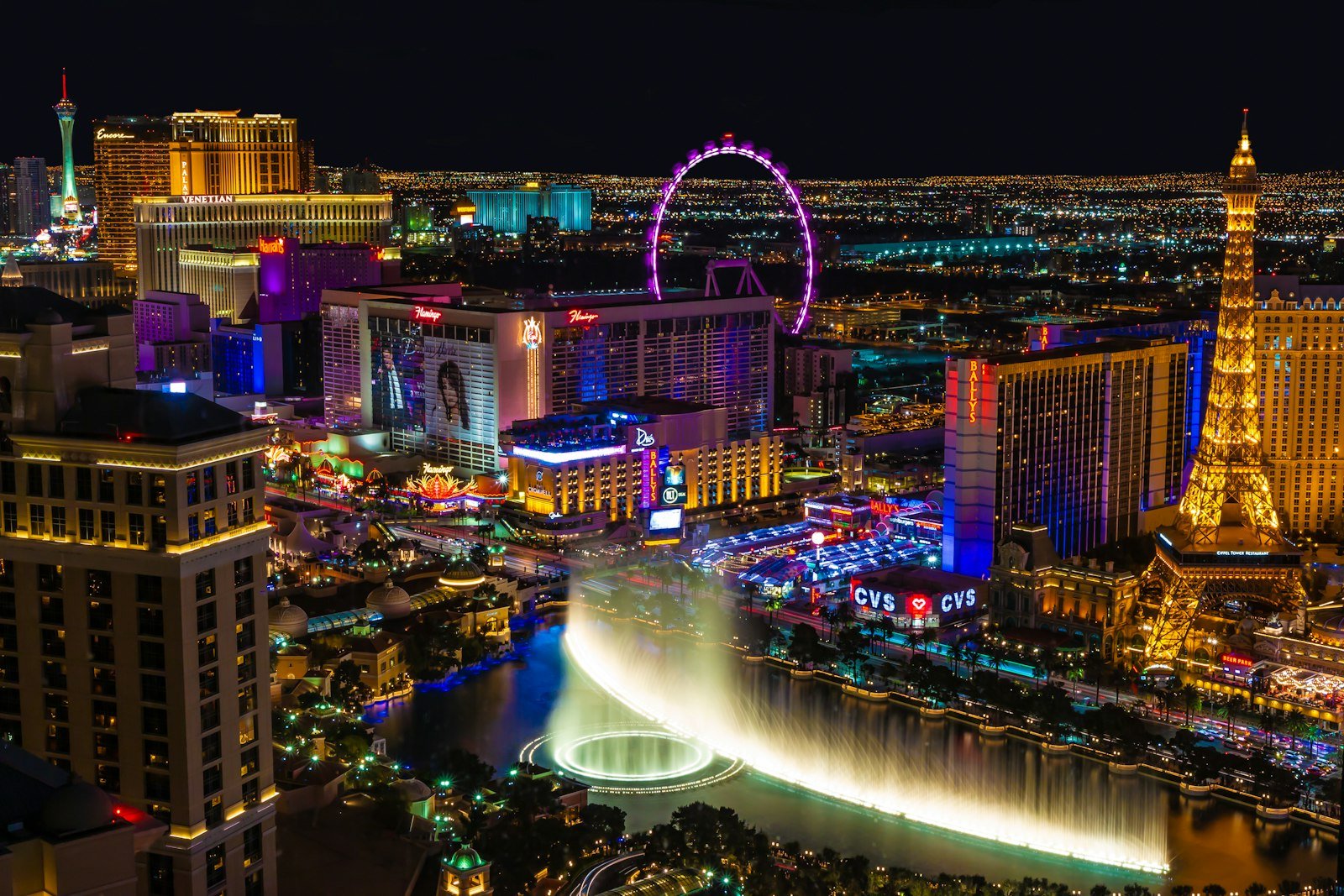 City with lights turned on during night time